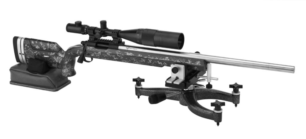 6. Position rest and rear bag as necessary to align your rifle sights with target, making sure fore-end of rifle remains against fore-end stop. 7.