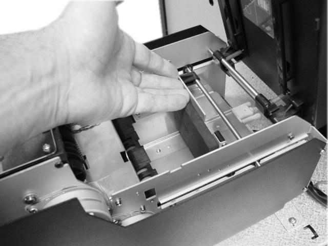 Step 4 Push the slide the push plate located inside the cash tray back (towards the rear of the dispenser)