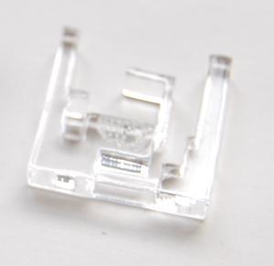 About the Protective Frame Around the DC-DC chip (U2), there is an Acrylic protective frame, which sticks on the top surface of the PCB with adhesive gel. What is this frame for?