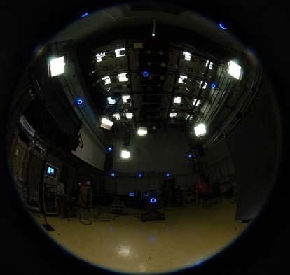 Fig. 3. A picture of the studio taken with a Costal Optics spherical lens showing all major light sources. images is combined into one HDRI, as described in [11].