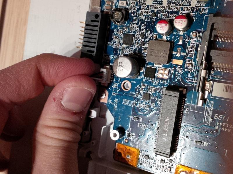 .) circkled in red. now remove the black screw, if you unscrew it, the pci e card will come towards you.