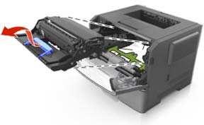 3. Lift the green handle, and then pull the imaging unit out of the printer.