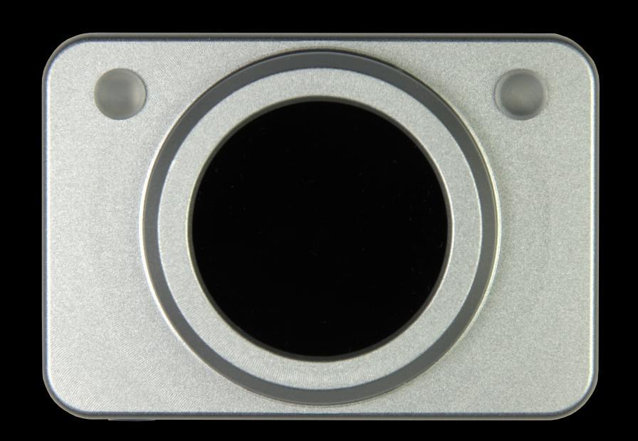 Figure 1: HeadMouse Nano Front Panel. Optical tracking sensor in the middle, infrared receiver for available Beam on the left and status LED on the right.