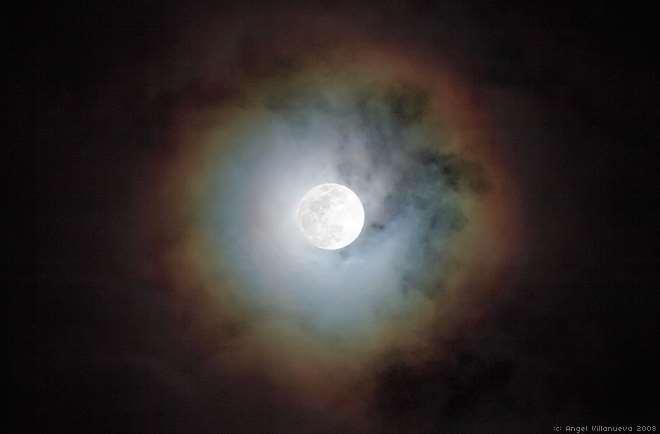 Halos are caused by the light of the sun or moon passing through a very thin layer of cirruform (ice-crystal) clouds in the upper atmosphere.