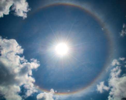 Just like a rainbow, strong halos can have bands of color in them, due to slightly different refractive properties of the ice crystals for different colors.