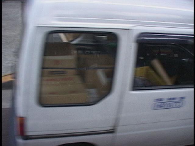 vehicle along Route 246 in Tokyo. The target vehicle is a white minivan as shown in two upper photographs of Figure 6.