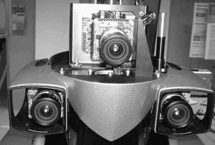 VISION SYSTEM Fig. 1. Cooperative Works HRP-2 has a trinocular stereo camera system on its head.