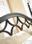 Box-mitered bead moldings, stylized Italian legs, overlay panels, and woven accents create interest, while custom oval ring-pull hardware in aged pewter adds