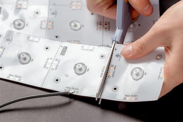 Once cut, each partial sheet will need its own cable to connect it to a DC 24V source. We recommend using 18 AWG wire as for any connecting cables.