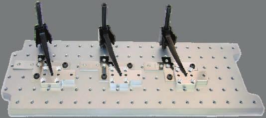 Interlocking fixture plates quickly secure and release with the use of magnets