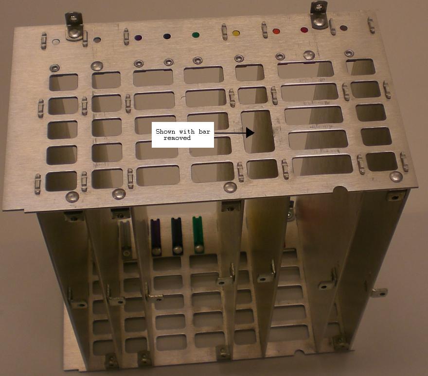 2-35 Nibble out the third from the top ½ by ⅛ card cage bar on the side of the A3A4 card cage facing the CRT to make a routing path for the A3A4 W2 cable.