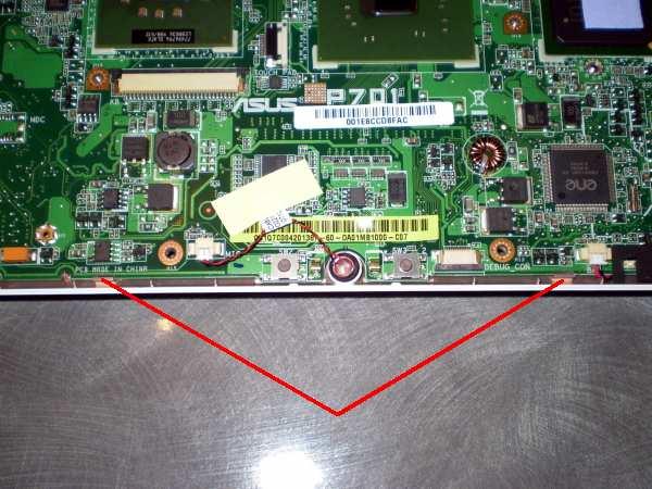 15. Gently lever up the front of the motherboard