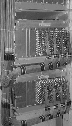 Chapter 1 Cable Management Specifications Traverse 600 Copper and Coax Cable Routing The following image shows Traverse shelves with two cable management bars each, Mini-SMB cabling, and ECMs.