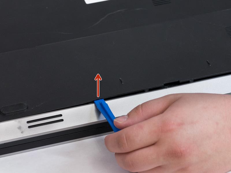 Pull battery upwards by the tab to remove from the laptop.
