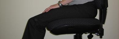 Provide a footrest. Adjust back rest angle or seat tilt angle.