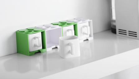 CUBE MUG The playful Cube Mug is like a time machine that transports you back to