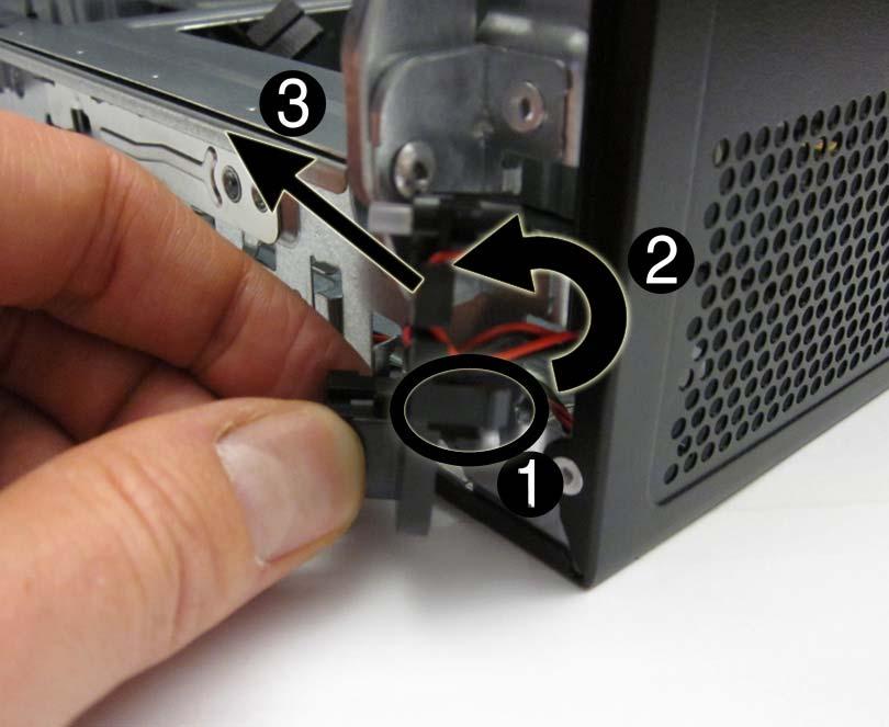 7. Rotate the power switch right to left (2), and then remove it from the computer (3) while routing the cable through the hole in