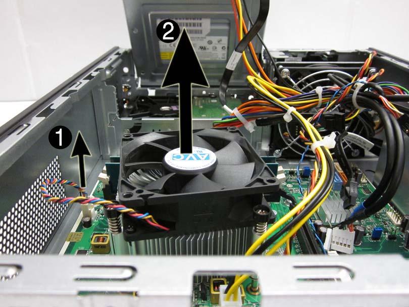 4. Disconnect the cable from the system board (1), lift the fan sink from atop the processor (2) and set it on its side to keep from contaminating the work area with thermal grease.