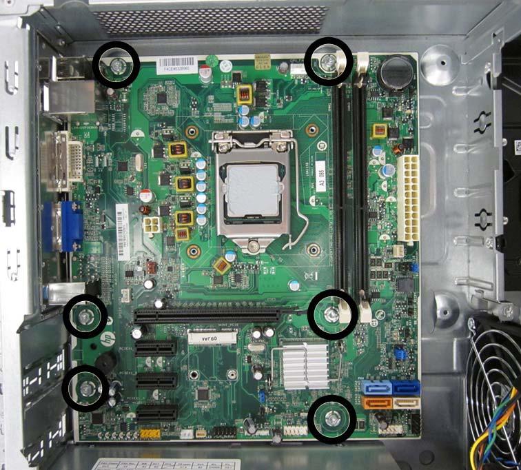 9. Remove the six screws that secure the system board to the chassis. NOTE: System board appearance may vary.