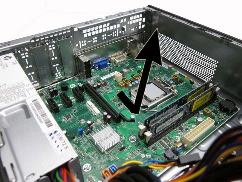 Slide the system board away from the rear of the computer to disengage the ports, and then lift the board up and out