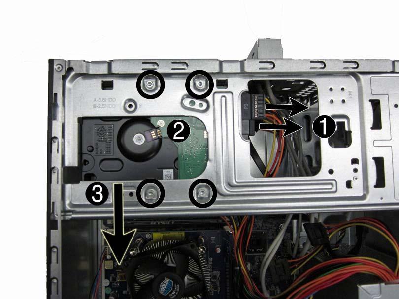5. Slide the hard drive toward the bottom of the computer (3), and then remove it from the computer.