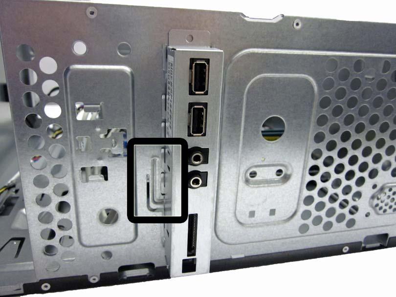 6. Push in on the lever to the left of the assembly. Figure 7-19 Front I/O connectors 7.