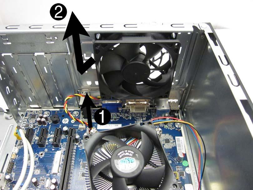 5. From the inside of the computer, disconnect the cable from the red/brown system board connector labeled SYS_FAN (1), pull the fan into the chassis until it clears the chassis lip, and then lift it