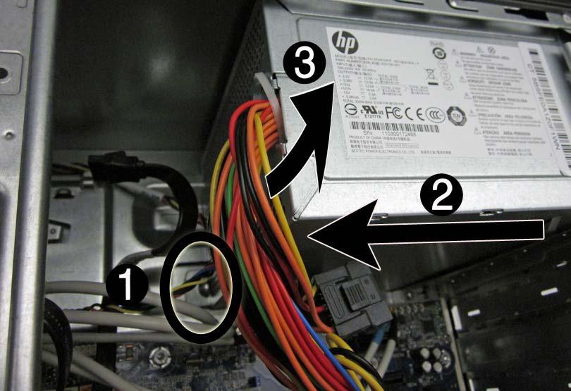 6. Slide the power supply toward the front of the computer (2), then lift the power supply out of the computer (3).