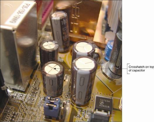 Figure 4-20 Capacitors on a motherboard or other circuit board often have