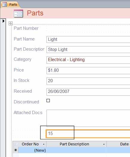 Click and drag the Part Number field down the form and position below the Attached Docs field.