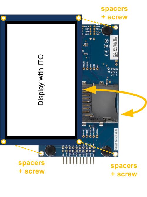 Figure 4-3. Bottom Side Mounting The stacking is supported by spacers and screws. Figure 4-4, Display Module Top-Stacked on page 3 shows an display module stacked on top of a MCU board.