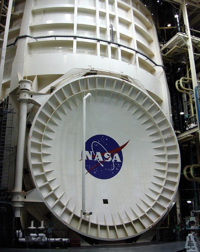 The chamber has an outside diameter of over 60 feet and a height of almost 120 feet. The payload door shown alone measures over 30 feet in diameter.