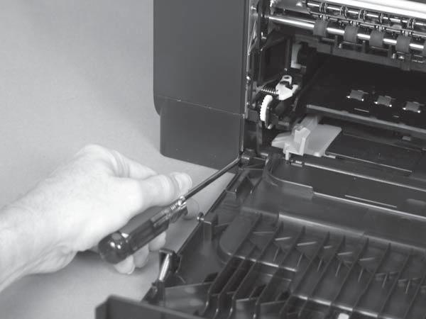 Insert a flat-blade screw driver between the door hinge and the chassis to push the post (callout ) toward the product