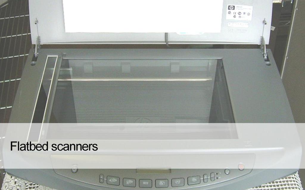A flatbed scanner is usually composed of a glass pane (also called a platen) under which there is a bright light which illuminates the pane, and a moving CCD sensor that captures the image.