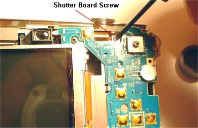 Remove the Shutter Board Screw as shown above.