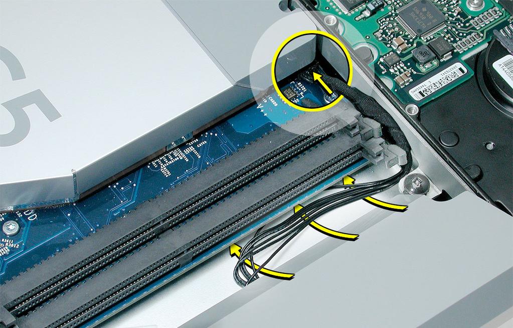 4. Press in the latches on the memory slots in and route the black inverter cable along the side of the hard drive.
