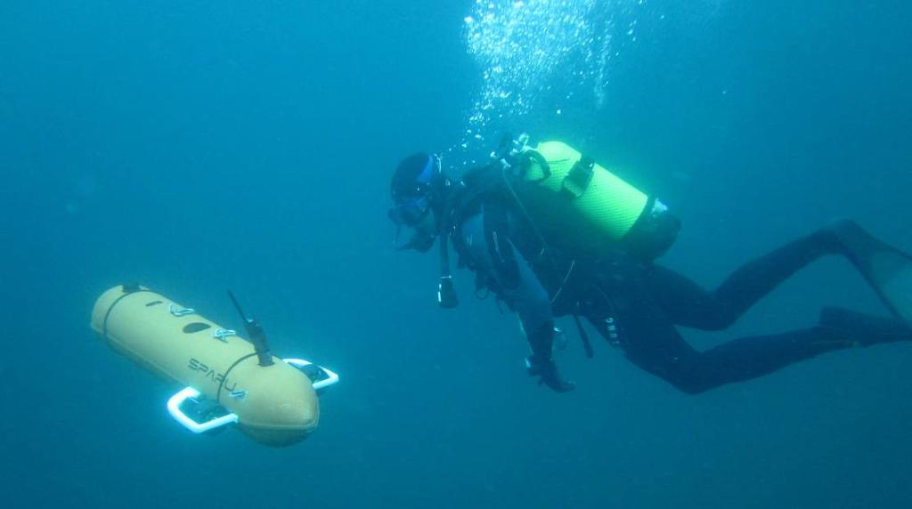 Fig.2: Picture of SPARUS AUV operating open water under the supervision of a diver. Some widely used sensors for land and aerial robots do not work or are not precise enough underwater.