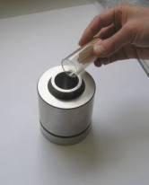 Fill the sample-mixture carefully into the die and make
