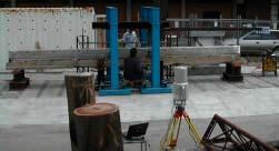 Fig. 3: Concrete beam (in the load testing frame) and the I-SiTE R-350 instrument. 4.