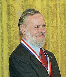 Dennis Ritchie originally developed C at Bell Labs to write the UNIX operating system, 1974. C was designed to provide low level access to the hardware, which an OS requires.
