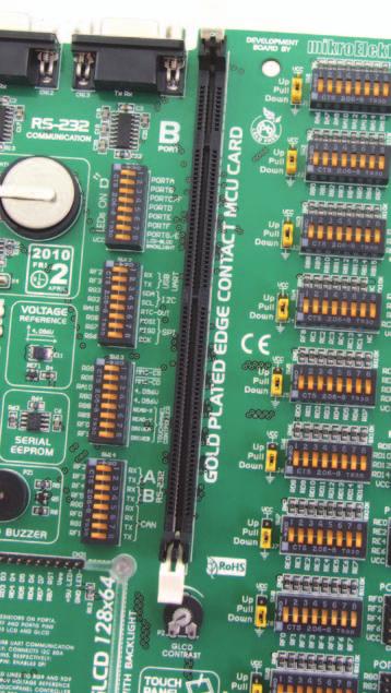 This development system comes with an MCU card with a microcontroller in 80-pin TQFP package soldered on it, Figure 2-3.