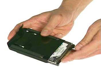 5. Push the HDD module into the notebook and secure 2 screws on the