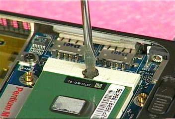 Turn the non-removable screw here 180 degrees clockwise to fix the CPU and