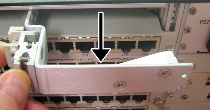 AIO-16 69 6. Carefully remove the extended card plate from its slot. 7. Taking care to fit the RJ-45 Backcard in the guides properly, place the card in the desired slot. 8.