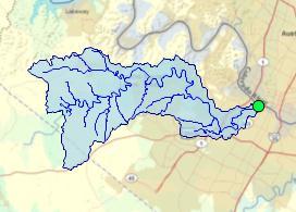After a moment, the watershed is shown in the map (highlighted in blue in Figure 8). The NHD reaches flowing to the point that you clicked and the point itself are also shown.