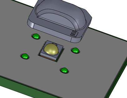 Figure 6: A small droplet of glue is placed at each of the 4 solder-mask recess locations, to bond the 4 lens bumps to the PCB.