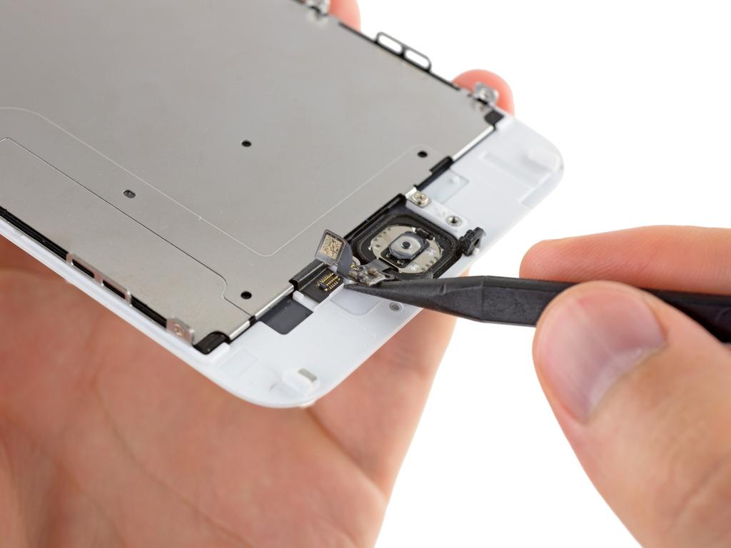 Gently move the spudger across to separate the home button connector cable from the adhesive securing it to the front panel assembly.