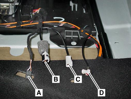 2. In the right side compartment of the carrier plate, find the: Antenna switch 2-pin power supply connector (A, Figure 3) Telephone FAKRA female, black connector (B, Figure 3) 3.