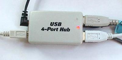 The easy solution to the problem is to buy an inexpensive USB hub. The USB standard supports up to 127 devices, and USB hubs are a part of the standard.