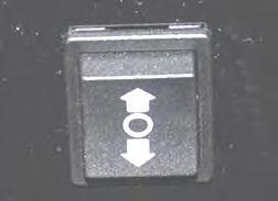 Press the height adjustment button (rocker switch) on the left side of the Light Board.